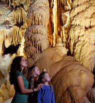 Family Looking at Cave Formations