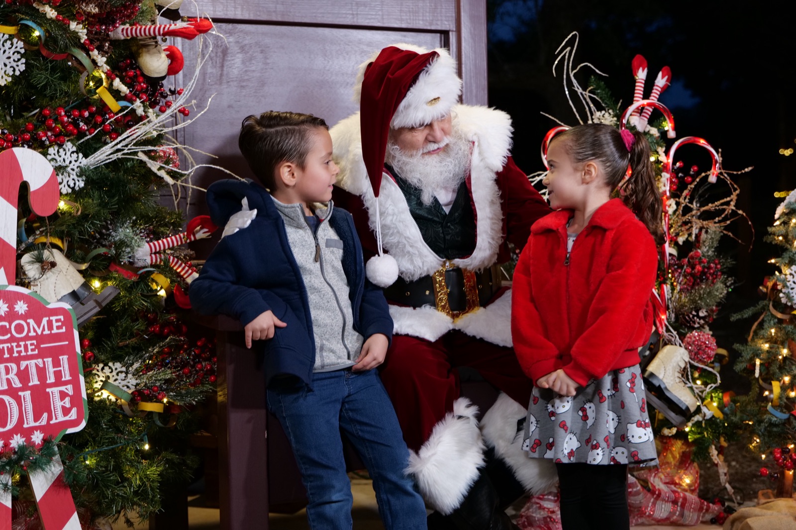 Two children meeting Santa at Christmas at the Caverns